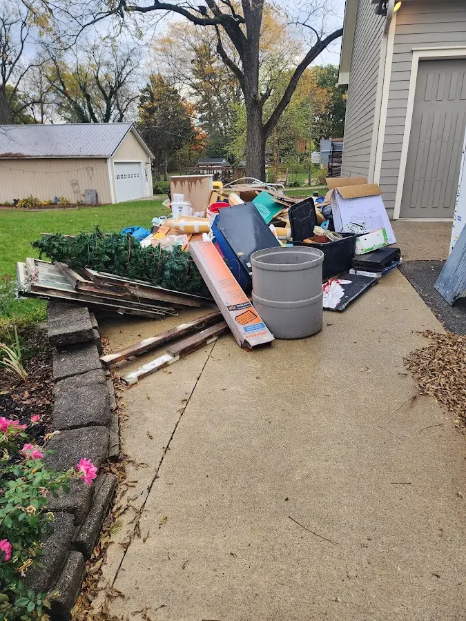Dumpster being loaded with debris for 30 Yard Dumpster Rental in White Rock
